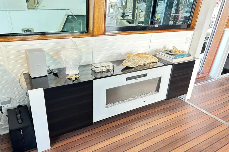Slide: The Image of Interior of 1979 Hatteras 53 Motor Yacht with elegant decor and modern fireplace. - 27