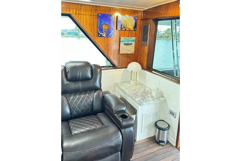 Slide: The Image of Luxurious interior of 1979 Hatteras 53 Motor Yacht with leather seating and elegant decor. - 31