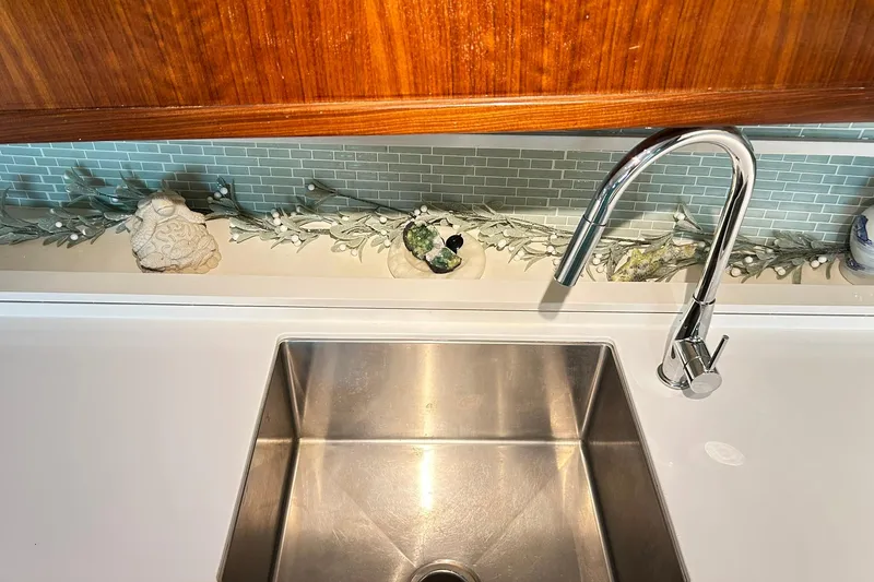 Slide: The Image of Stainless steel sink and modern faucet on 1979 Hatteras 53 Motor Yacht Hard Top. - 50