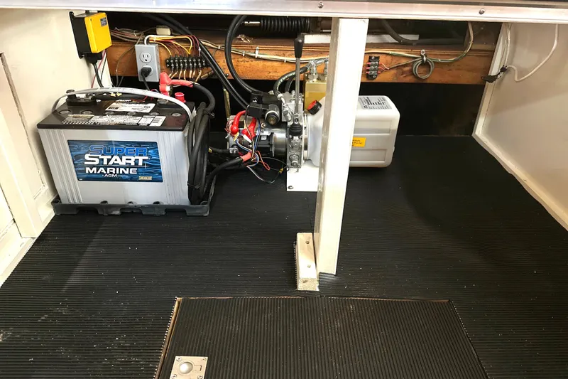 Slide: The Image of 1979 Hatteras 53 Motor Yacht Hard Top engine room with marine battery and equipment. - 70