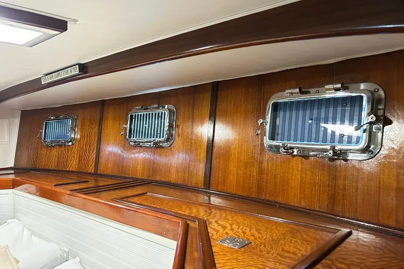 Slide: The Image of Interior of 1979 Hatteras 53 Motor Yacht with polished wood and portholes. - 71