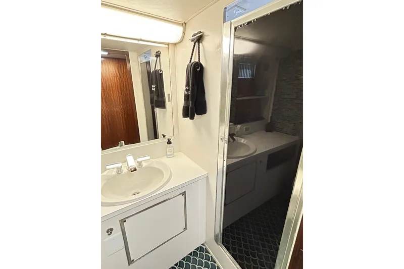 Slide: The Image of Bathroom interior of 1979 Hatteras 53 Motor Yacht Hard Top with sink and mirror. - 77
