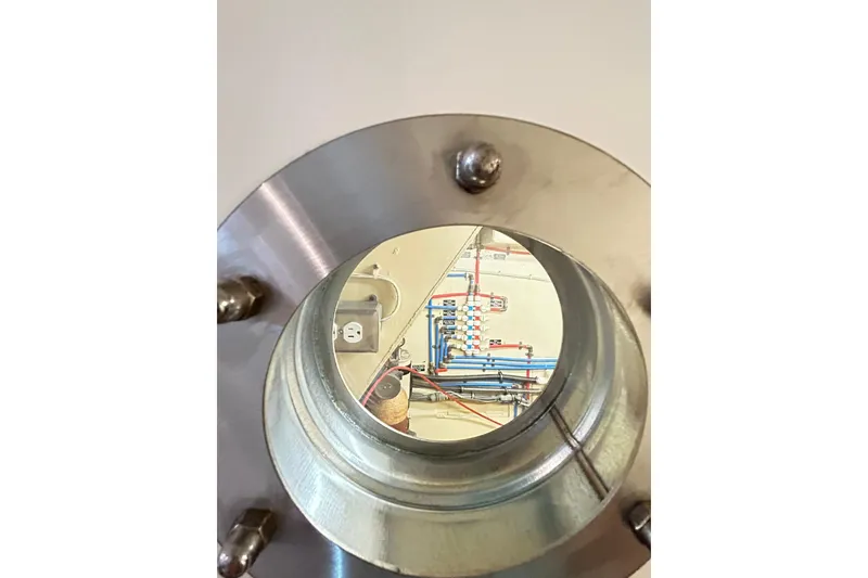 Slide: The Image of Close-up of a 1979 Hatteras 53 Motor Yacht Hard Top component, showcasing interior wiring and pipes. - 89