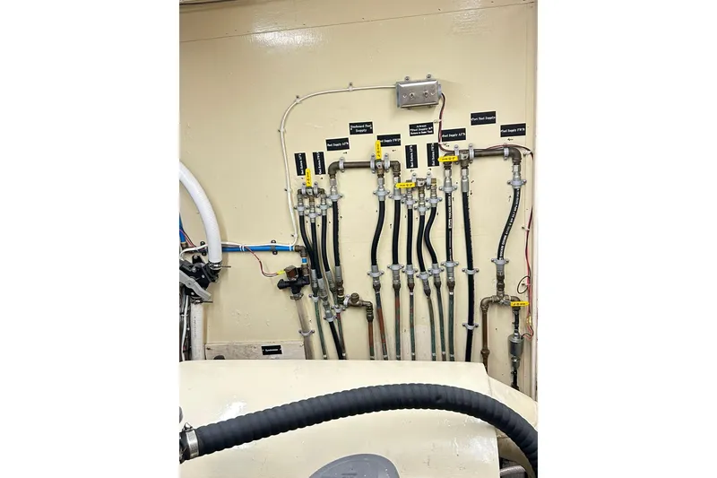 Slide: The Image of Engine room piping system of 1979 Hatteras 53 Motor Yacht Hard Top. - 94