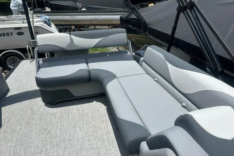 Slide: The Image of 2025 Avalon LSZ Cruise Rear Bench with sleek gray seating on a boat deck. - 4