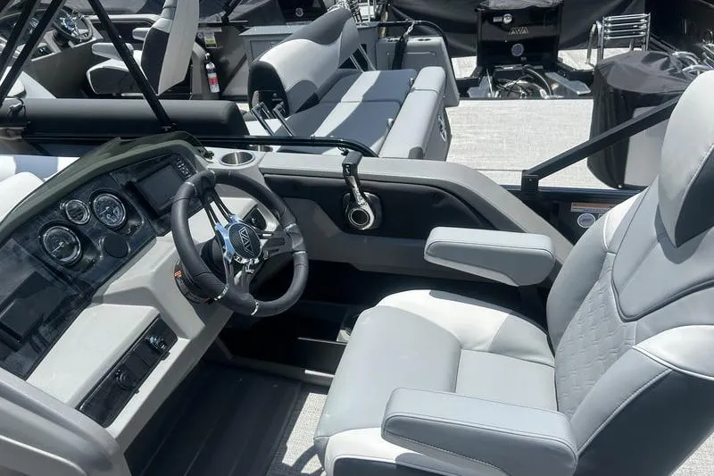Slide: The Image of 2025 Avalon LSZ Cruise Rear Bench boat interior with modern steering and comfortable seating. - 5