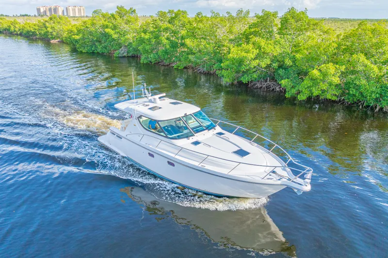 The Image of 2011 Tiara Yachts 4300 Sovran cruising on a scenic waterway. - 0