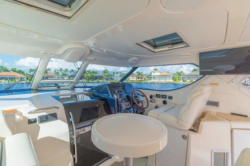 Slide: The Image of Luxurious interior of 2011 Tiara Yachts 4300 Sovran with helm and seating area. - 14