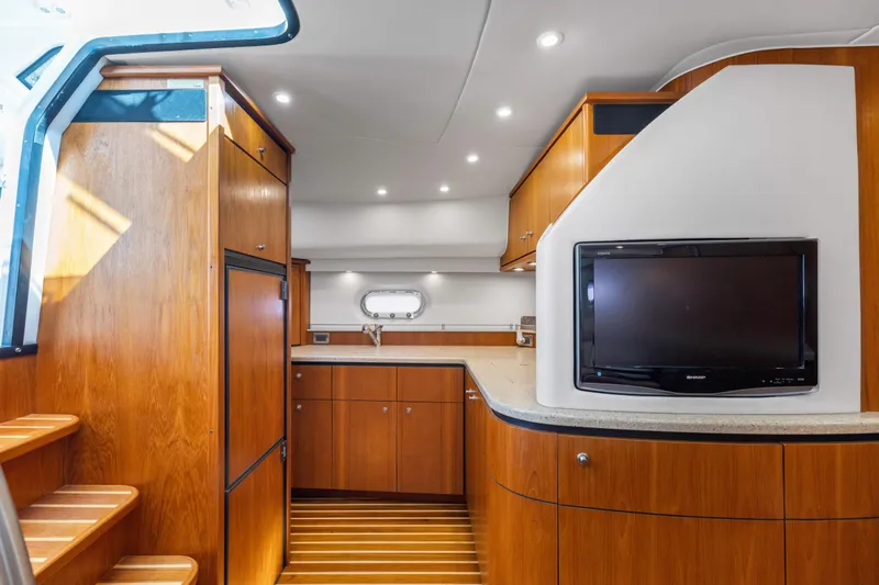 Slide: The Image of Luxurious interior of 2011 Tiara Yachts 4300 Sovran with wood cabinetry and modern amenities. - 21