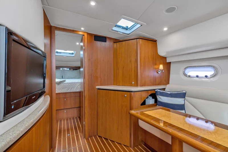 Slide: The Image of Luxurious interior of 2011 Tiara Yachts 4300 Sovran with wood finishes and modern amenities. - 23