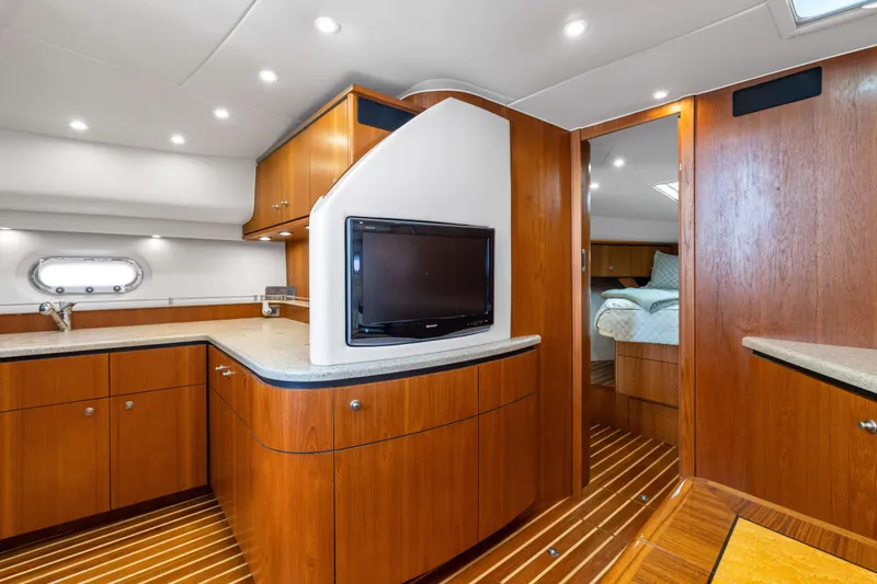 Slide: The Image of Luxurious interior of 2011 Tiara Yachts 4300 Sovran with wood cabinetry and modern amenities. - 26