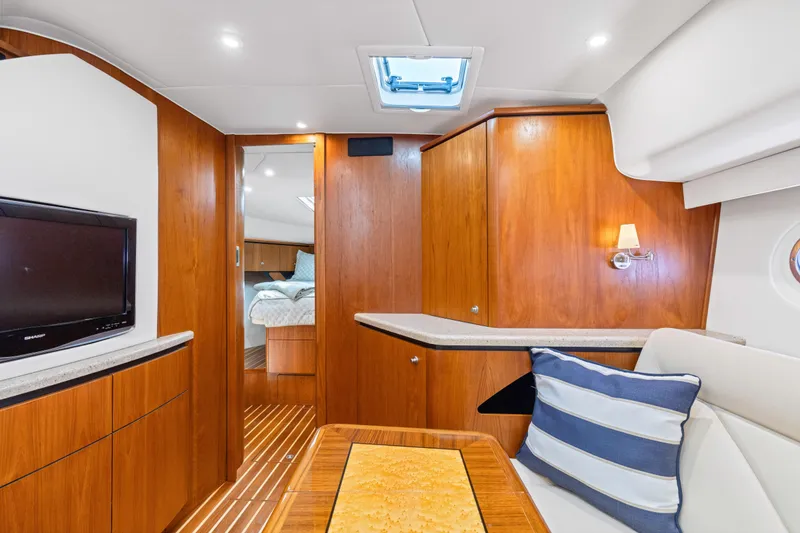 Slide: The Image of Luxurious interior of 2011 Tiara Yachts 4300 Sovran with wood finish and modern amenities. - 28