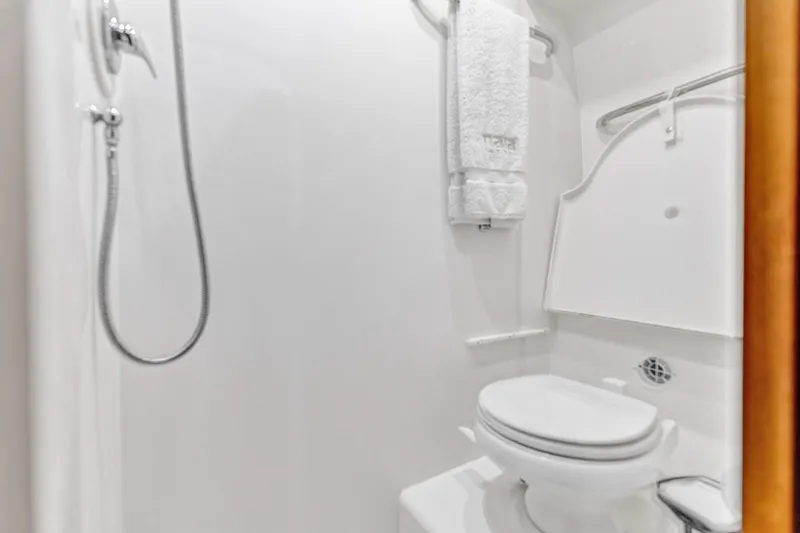 Slide: The Image of Bathroom interior of 2011 Tiara Yachts 4300 Sovran, featuring shower and toilet. - 34