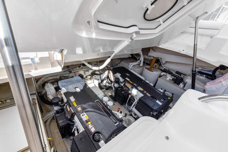 Slide: The Image of Engine room of 2011 Tiara Yachts 4300 Sovran, showcasing dual engines and mechanical components. - 37