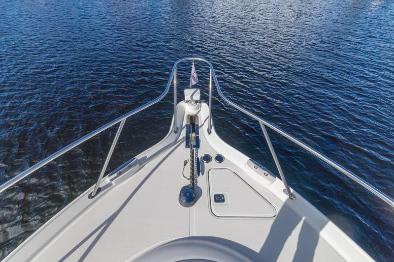 Slide: The Image of Bow view of 2011 Tiara Yachts 4300 Sovran on calm water. - 7