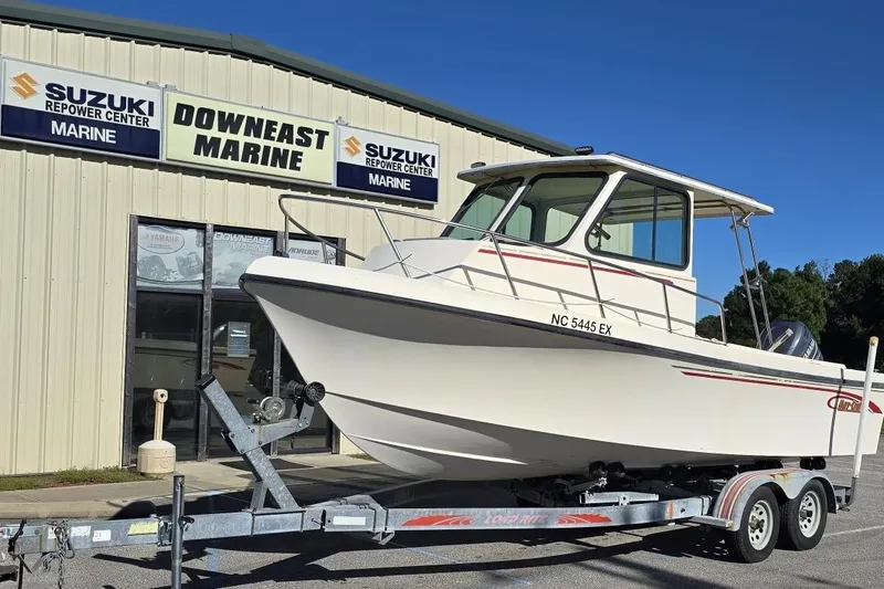 Slide: The Image of 2000 Maycraft Pilot House 2300 boat on trailer at Downeast Marine. - 6