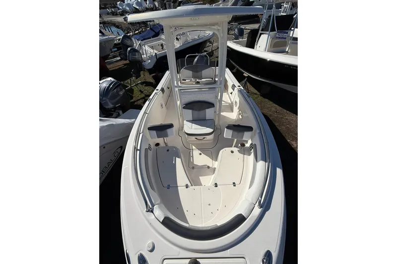 Slide: The Image of 2021 Robalo R222 Explorer boat, top view, showcasing spacious deck and seating. - 12