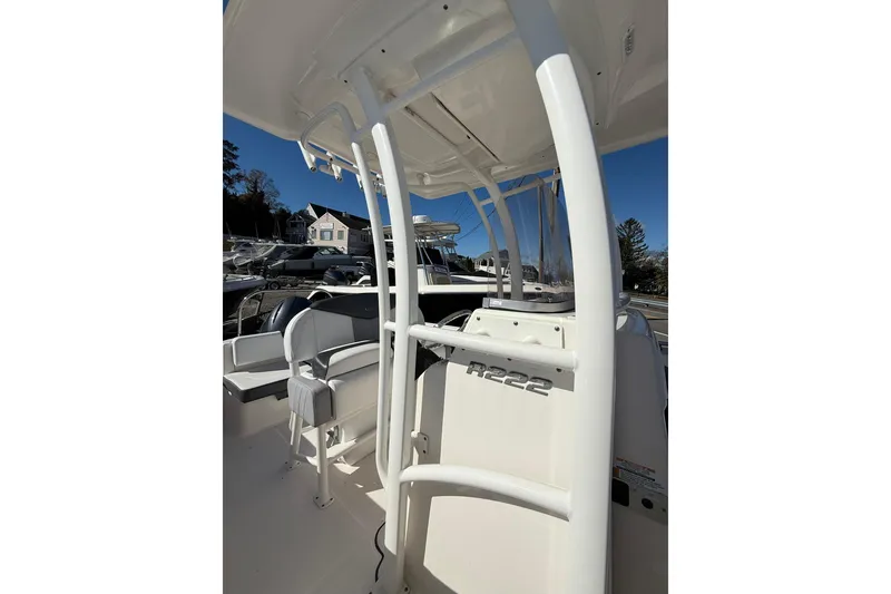 Slide: The Image of 2021 Robalo R222 Explorer boat interior with seating and console details. - 13