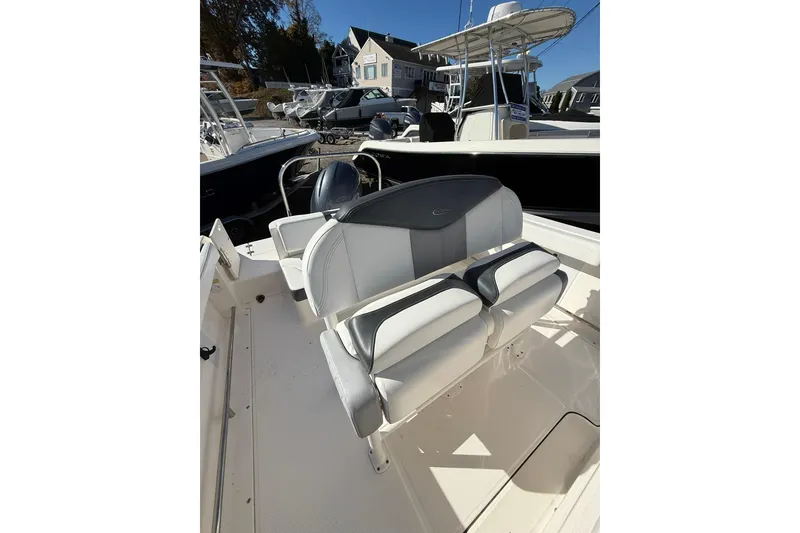 Slide: The Image of 2021 Robalo R222 Explorer boat interior with dual seating and steering wheel. - 4
