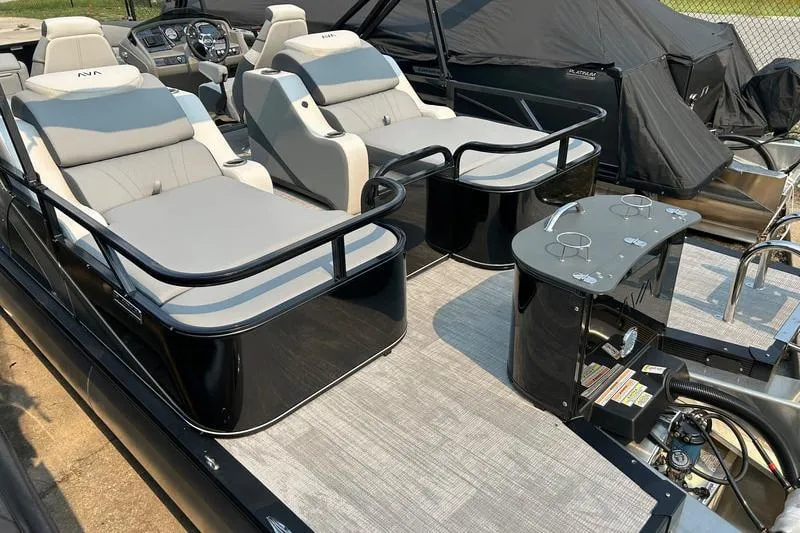 Slide: The Image of 2025 Avalon LSZ Rear Lounger pontoon boat with luxurious seating and sleek design. - 6