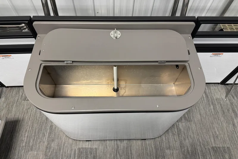 Slide: The Image of Open storage compartment in 2026 Qwest M-Class 22 Pro Sport boat, showcasing interior design. - 13