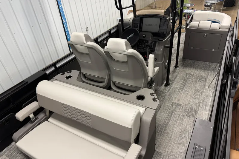 Slide: The Image of 2026 Qwest M-Class 22 Pro Sport boat interior with modern seating and control panel. - 15