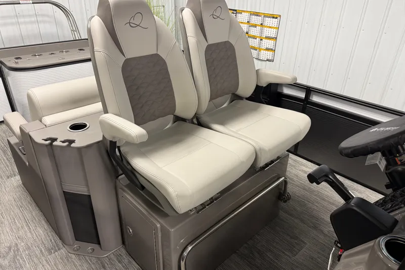 Slide: The Image of 2026 Qwest M-Class 22 Pro Sport boat seats with armrests and storage compartment. - 17