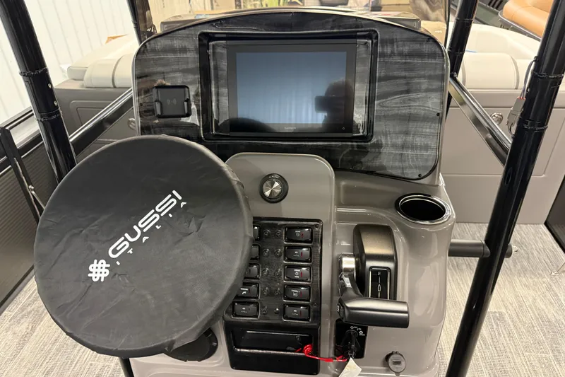 Slide: The Image of 2026 Qwest M-Class 22 Pro Sport boat dashboard with Gussi Italia steering wheel cover. - 19
