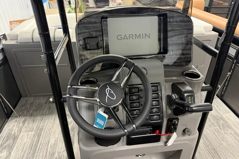 Slide: The Image of 2026 Qwest M-Class 22 Pro Sport boat dashboard with Garmin navigation system. - 24