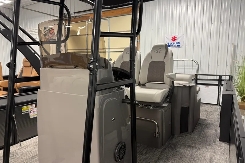 Slide: The Image of 2026 Qwest M-Class 22 Pro Sport boat interior with seating and console, displayed indoors. - 5