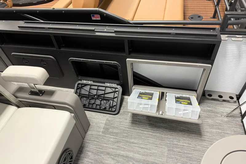 Slide: The Image of 2026 Qwest M-Class 22 Pro Sport boat interior with storage compartments and seating. - 9