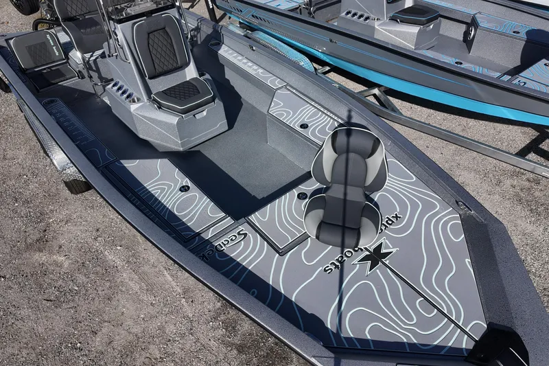 Slide: The Image of 2026 Xpress H22B Bay boat with sleek design and modern seating on display. - 10