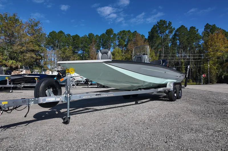 Slide: The Image of 2026 Xpress H22B Bay boat on trailer in outdoor setting. - 2