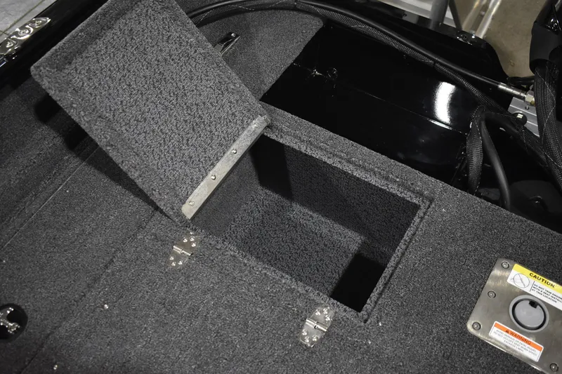 Slide: The Image of Open storage compartment in 2026 Lund 1650 Rebel XL Sport boat interior. - 18