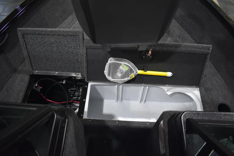 Slide: The Image of Interior view of 2026 Lund 1650 Rebel XL Sport boat, featuring storage compartments and equipment. - 20