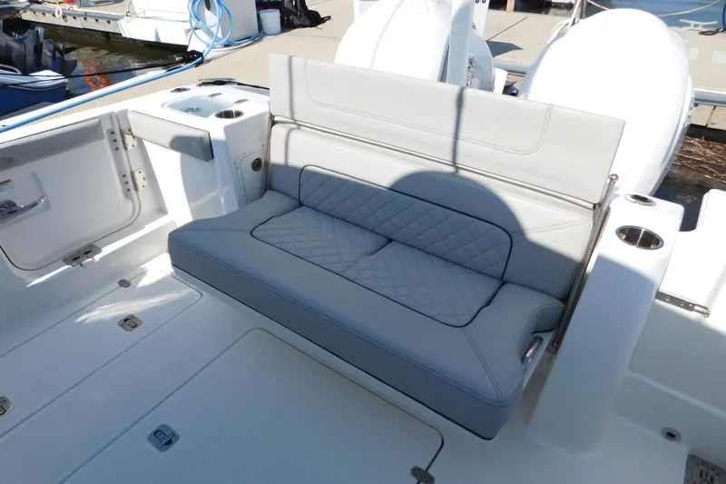 Slide: The Image of 2024 Pursuit DC 326 Dual Console boat interior with cushioned seating. - 15