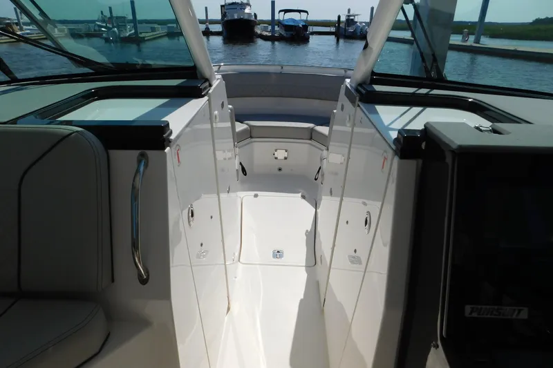Slide: The Image of 2024 Pursuit DC 326 Dual Console boat interior with sleek design and spacious layout. - 47