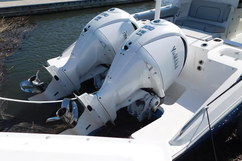 Slide: The Image of 2024 Pursuit DC 326 Dual Console with twin Yamaha outboard engines. - 5