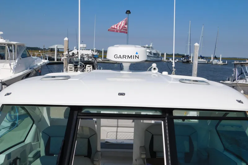 Slide: The Image of 2024 Pursuit DC 326 Dual Console boat with Garmin radar at marina. - 57