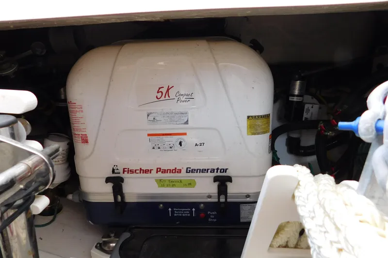 Slide: The Image of Fischer Panda generator in 2024 Pursuit DC 326 Dual Console boat engine compartment. - 91
