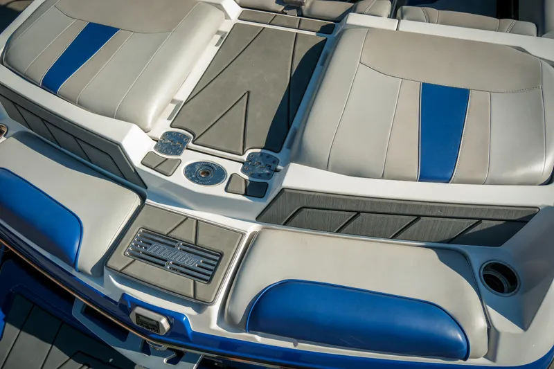 Slide: The Image of 2021 Malibu Wakesetter 23 LSV boat interior with blue and gray seating. - 14