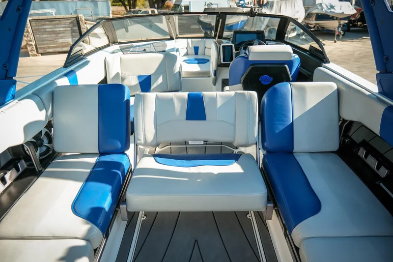 Slide: The Image of 2021 Malibu Wakesetter 23 LSV interior with blue and white seating, showcasing luxury design. - 25
