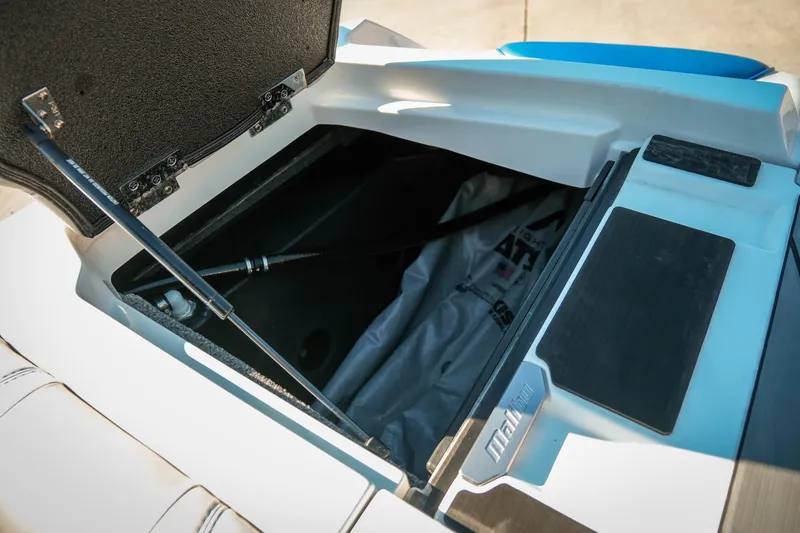 Slide: The Image of Open storage compartment in 2021 Malibu Wakesetter 23 LSV boat. - 27