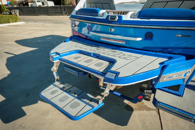 Slide: The Image of 2021 Malibu Wakesetter 23 LSV rear view with swim platform and step ladder. - 30