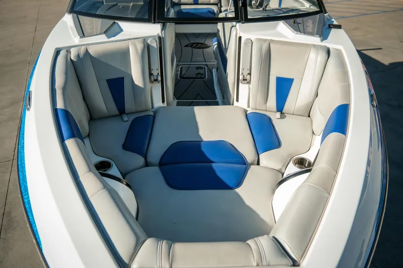 Slide: The Image of 2021 Malibu Wakesetter 23 LSV boat interior with blue and gray seating. - 32