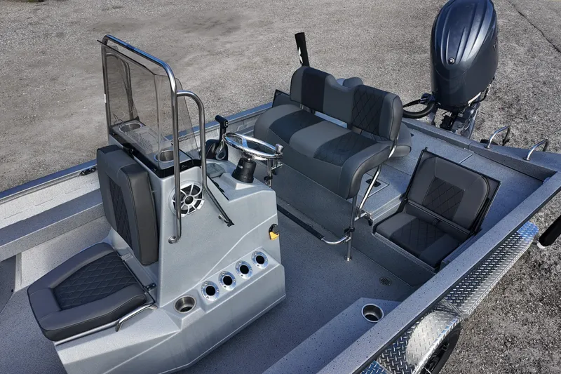 Slide: The Image of 2026 Xpress H22B Bay boat interior with seating and steering console. - 12