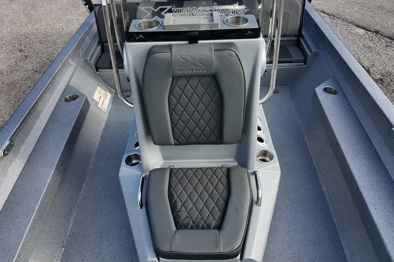 Slide: The Image of 2026 Xpress H22B Bay boat interior with diamond-stitched seating and cup holders. - 16