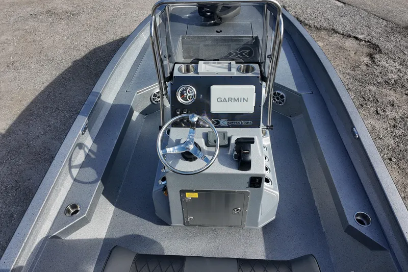 Slide: The Image of 2026 Xpress H22B Bay boat interior with Garmin navigation system and steering console. - 7