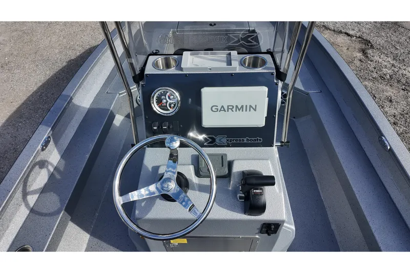 Slide: The Image of 2026 Xpress H22B Bay boat dashboard with Garmin navigation and steering wheel. - 8
