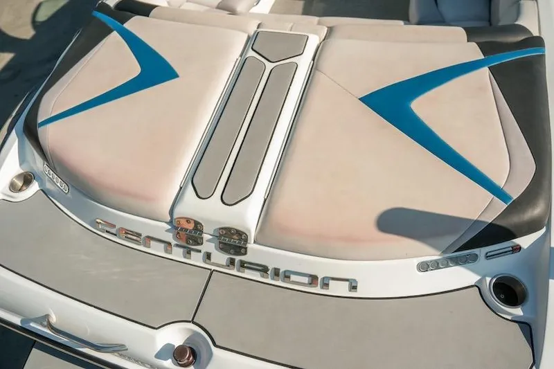 Slide: The Image of 2014 Centurion Enzo SV233 boat with sleek design and blue accents. - 14